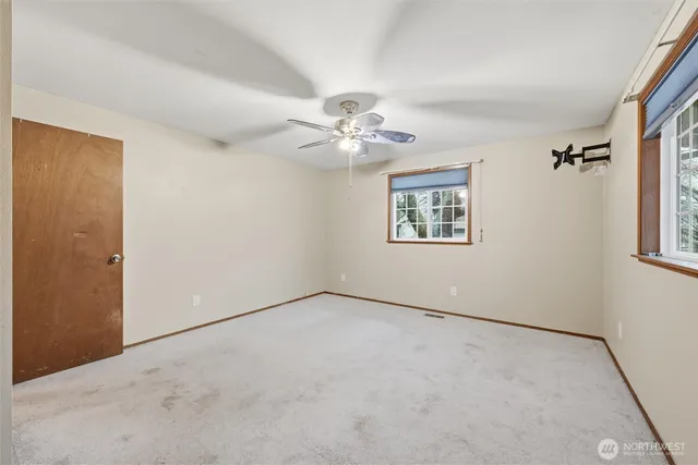 a bedroom with a bed and a table