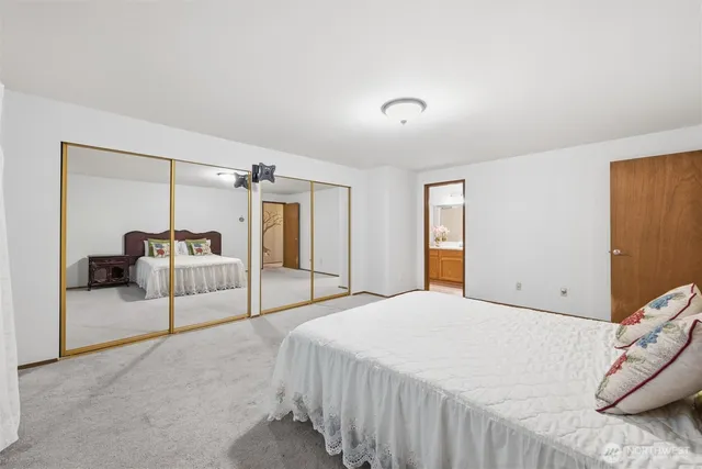 a white toilet sitting next to a bathroom sink