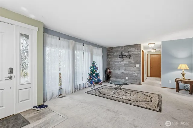 a living room with furniture and flowers