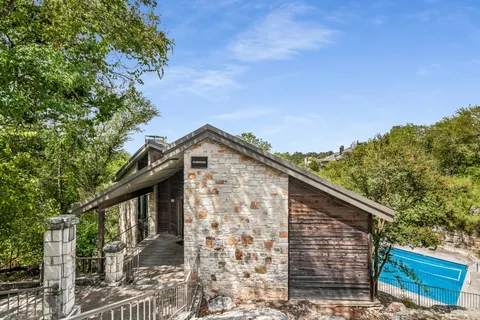 a view of a house with a tree