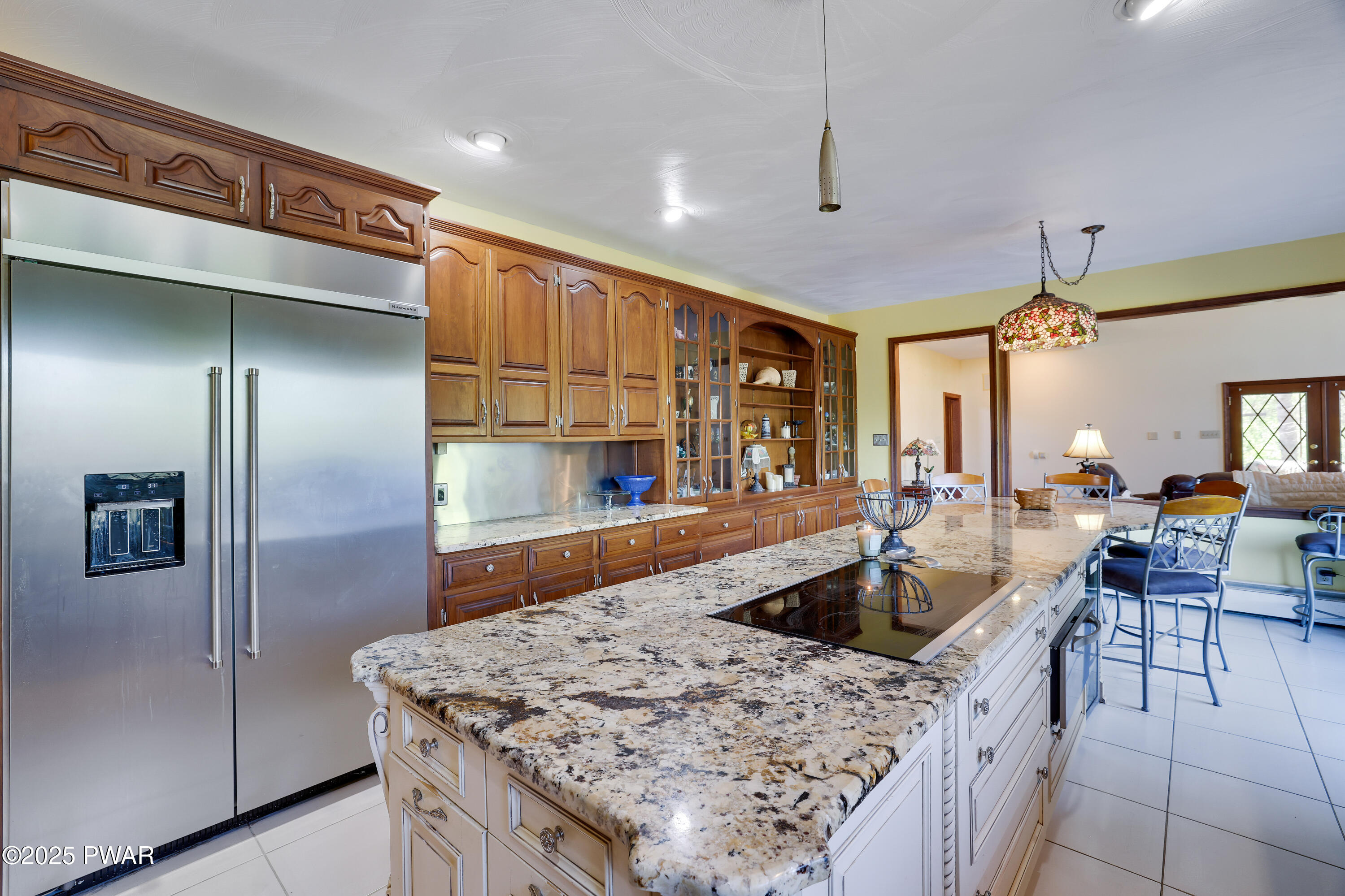 555 Valley View Road Dallas, PA 18612 - Photo 33 of 99 a kitchen with stainless steel appliances granite countertop a sink refrigerator and cabinets