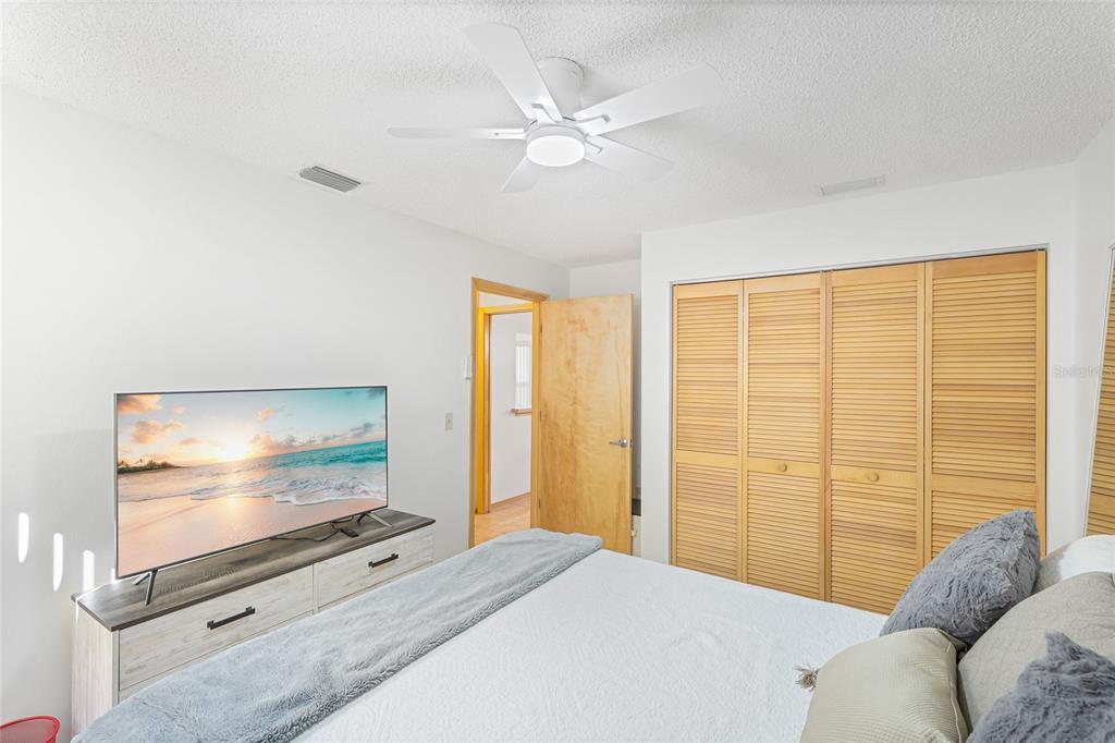 4537 South Lockwood Ridge Road Sarasota, FL 34231 - Photo 16 of 22 a living room with furniture and a flat screen tv