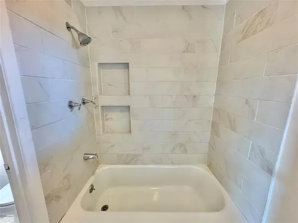 a close view of a bathtub in bathroom