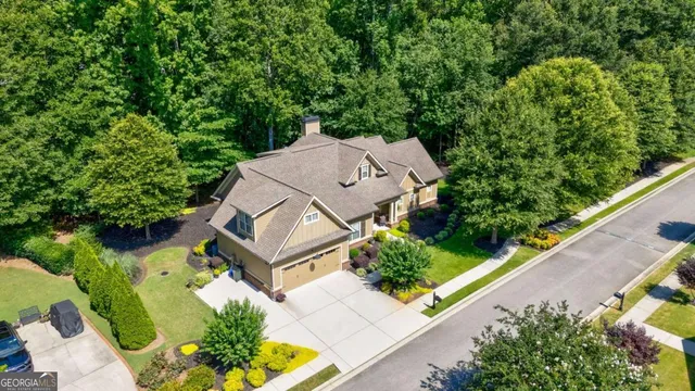 an aerial view of a house with a garden
