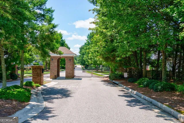 a living room with furniture a fireplace and a chandelier