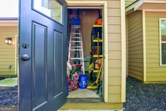 an aerial view of a house with yard swimming pool and outdoor seating