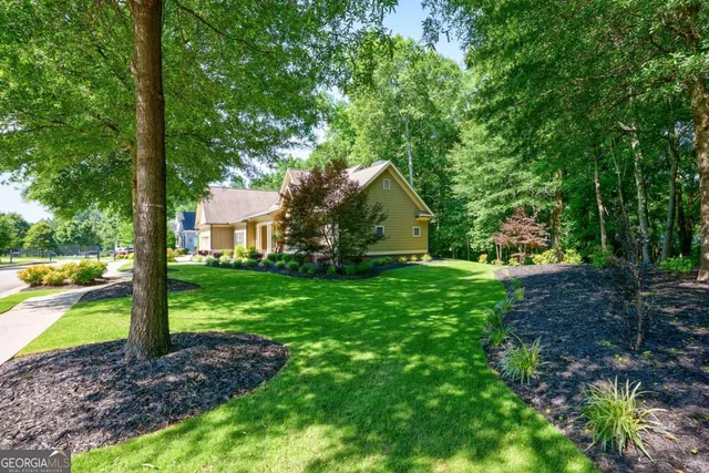 a view of swimming pool with outdoor seating and yard