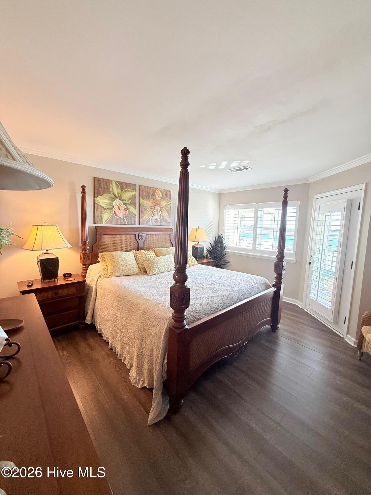 1912 Goose Creek Road Southwest, Unit 4103 Ocean Isle Beach, NC 28469 - Photo 16 of 52 large primary bedroom with stunning bed, dresser, and armoire