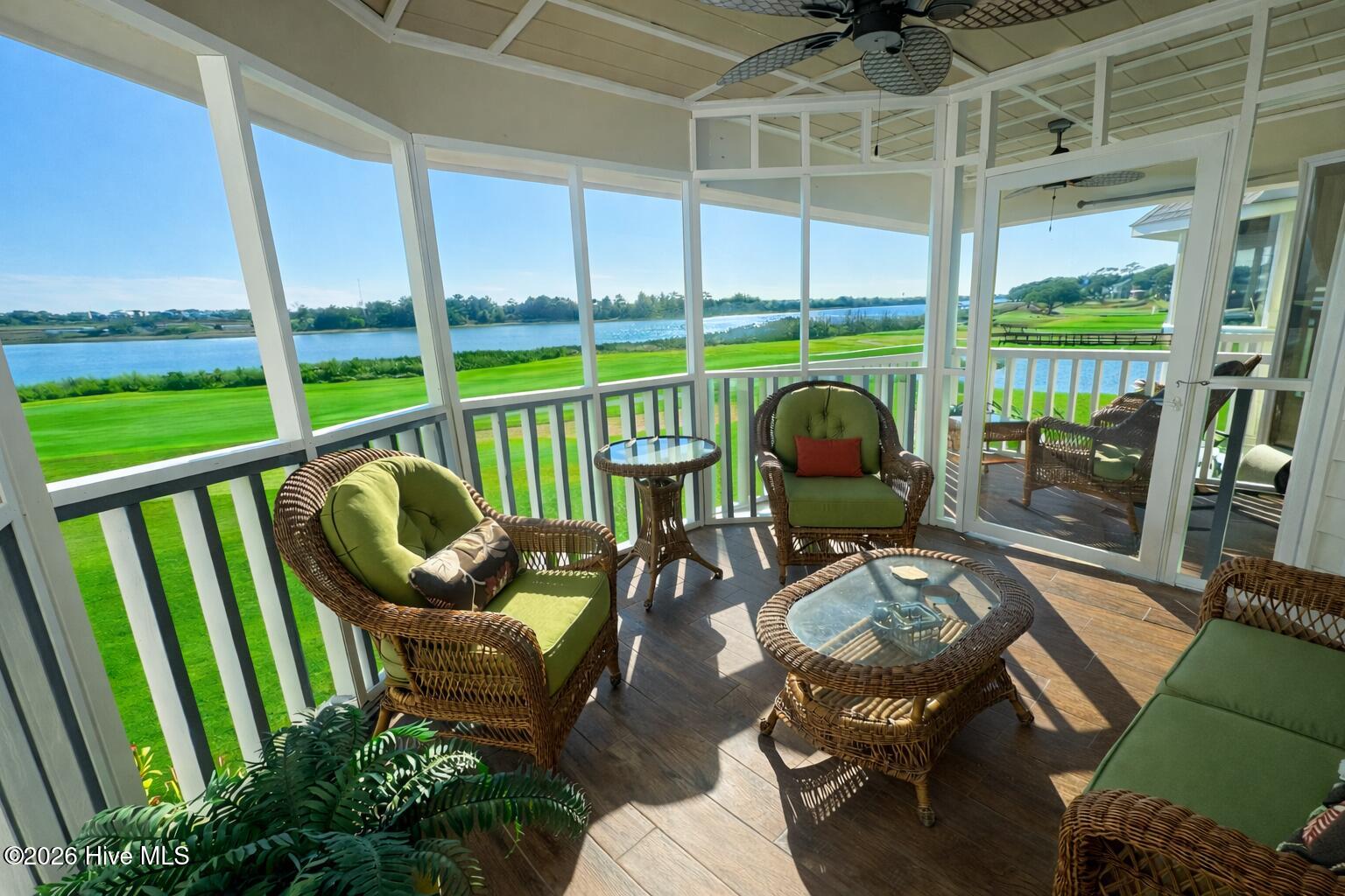 1912 Goose Creek Road Southwest, Unit 4103 Ocean Isle Beach, NC 28469 - Photo 29 of 52 screen porch overlooking fairway and intracoastal waterway
