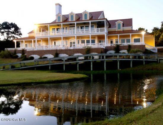 1912 Goose Creek Road Southwest, Unit 4103 Ocean Isle Beach, NC 28469 - Photo 40 of 52 walk to the clubhouse to play a round of golf enjoy the new restaurant
