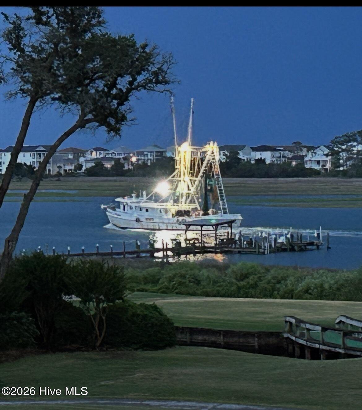 1912 Goose Creek Road Southwest, Unit 4103 Ocean Isle Beach, NC 28469 - Photo 50 of 52 sit on your porch and watch shrimp boats passing by.