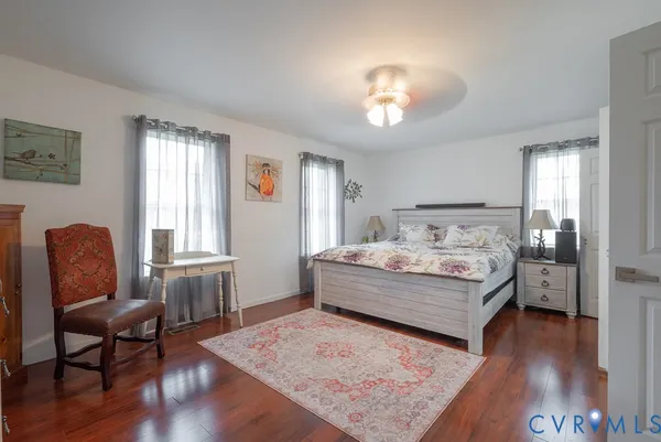 a room with a bed and chair