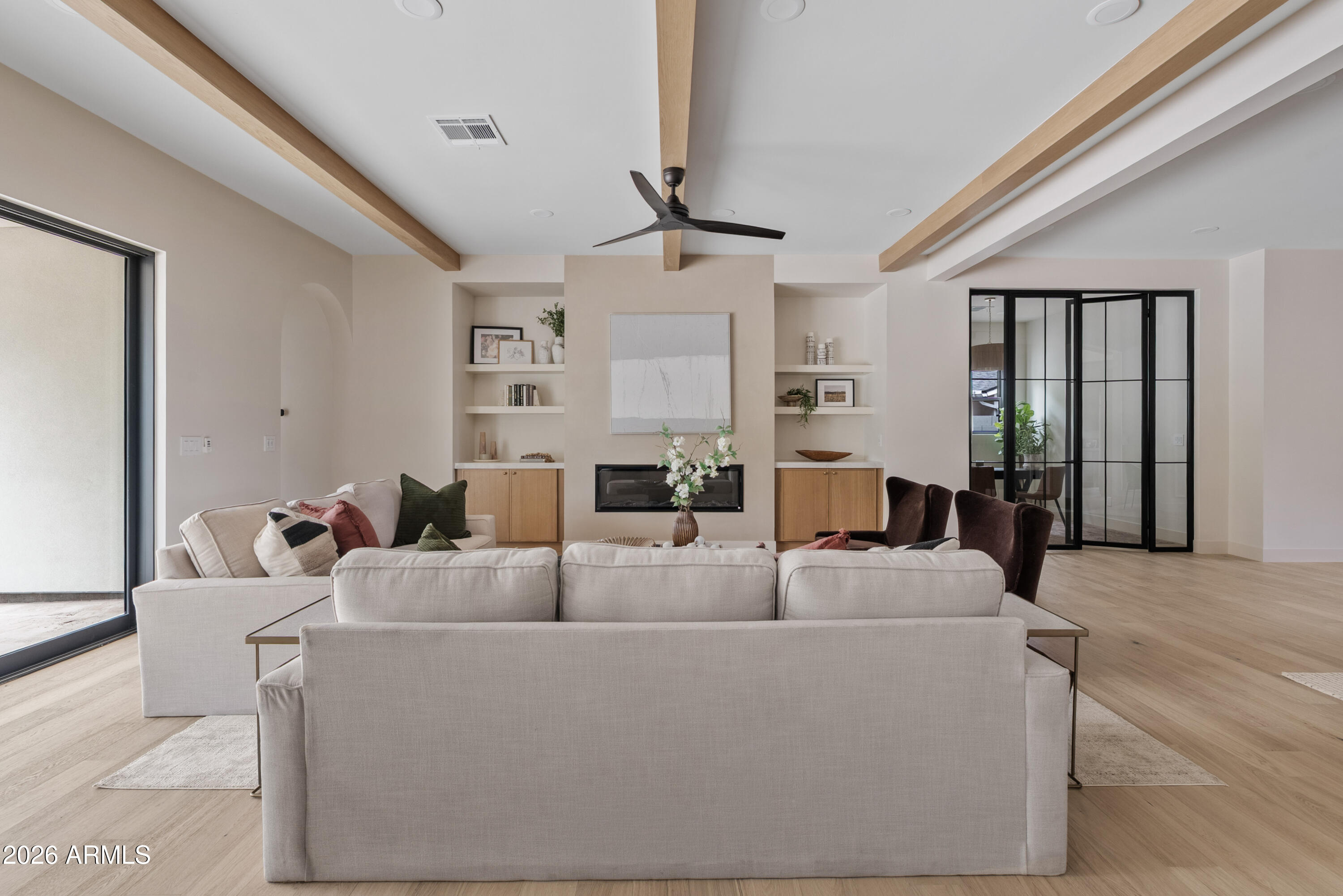 4035 East Osborn Road Phoenix, AZ 85018 - Photo 52 of 63 a living room with furniture a chandelier fan and a window