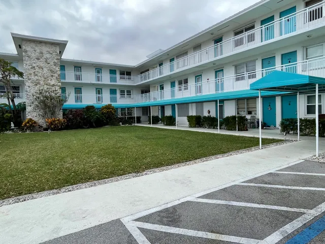 a view of building with yard