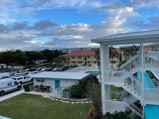 a view of a chairs and table in a patio