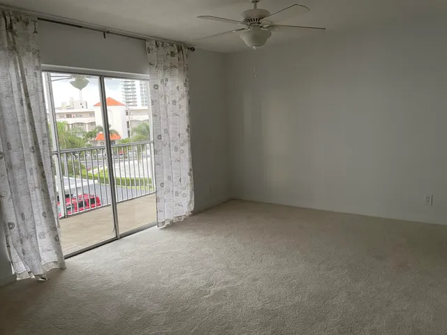 a view of empty room with windows