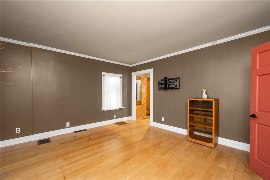 438 Main Street Prospect, PA 16052 - Photo 7 of 46 wooden floor and windows in an empty room
