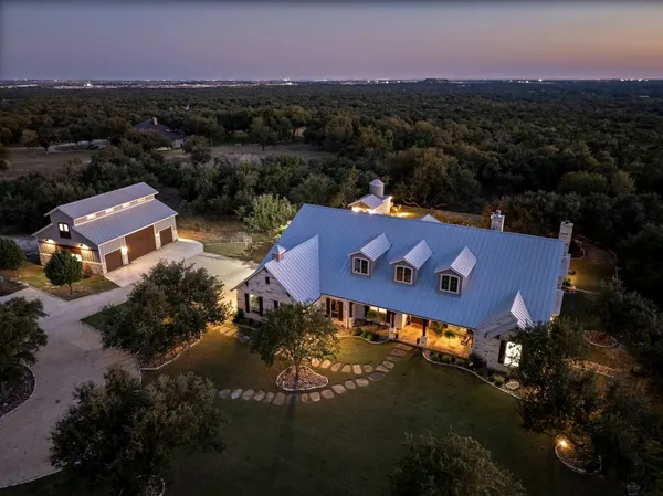 an aerial view of a house with a garden