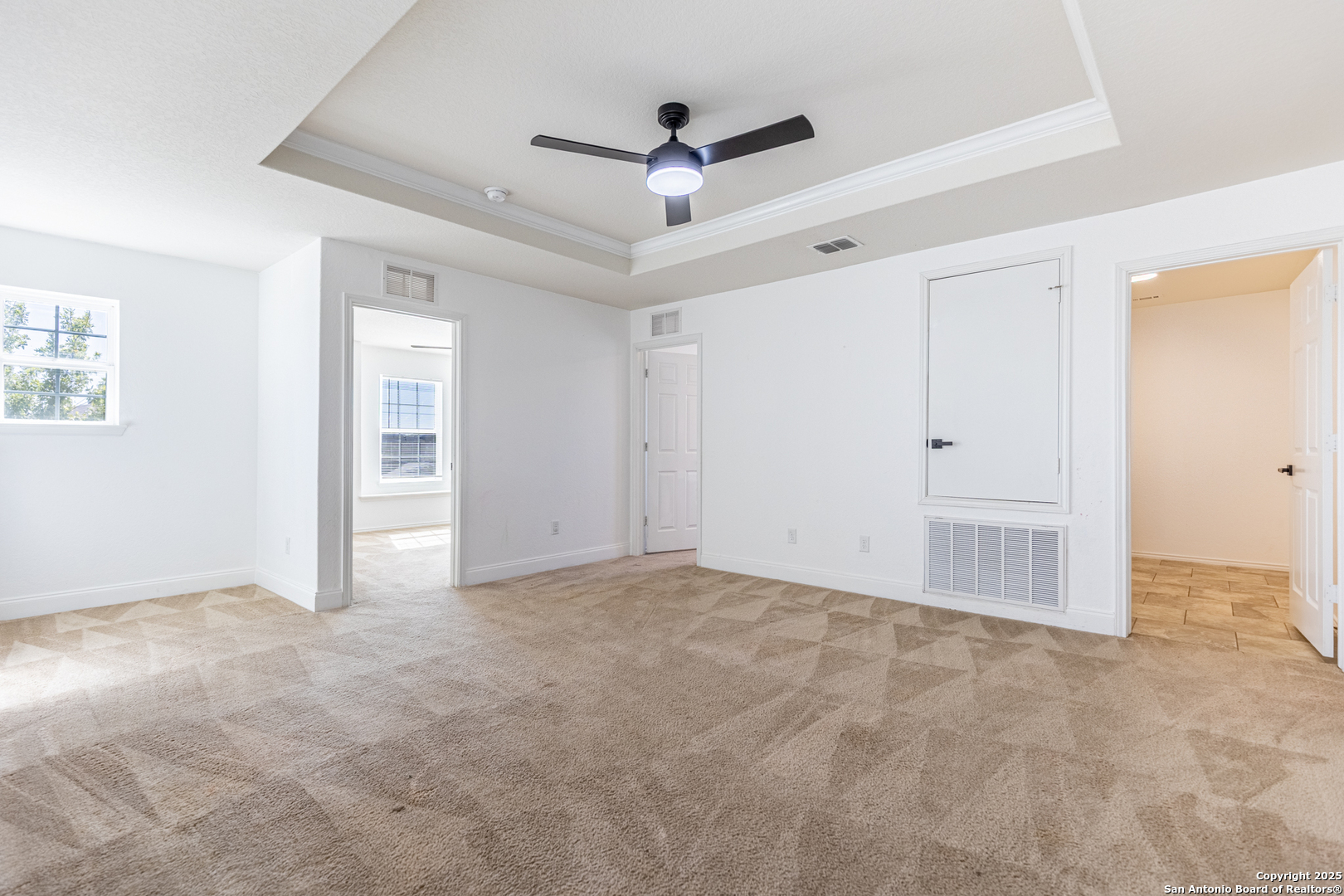443 Harvest Point Selma, TX 78154 - Photo 14 of 33 an empty room with closet and a ceiling fan