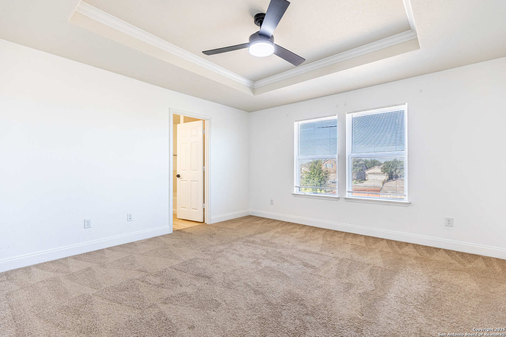 443 Harvest Point Selma, TX 78154 - Photo 17 of 33 an empty room with windows and fan