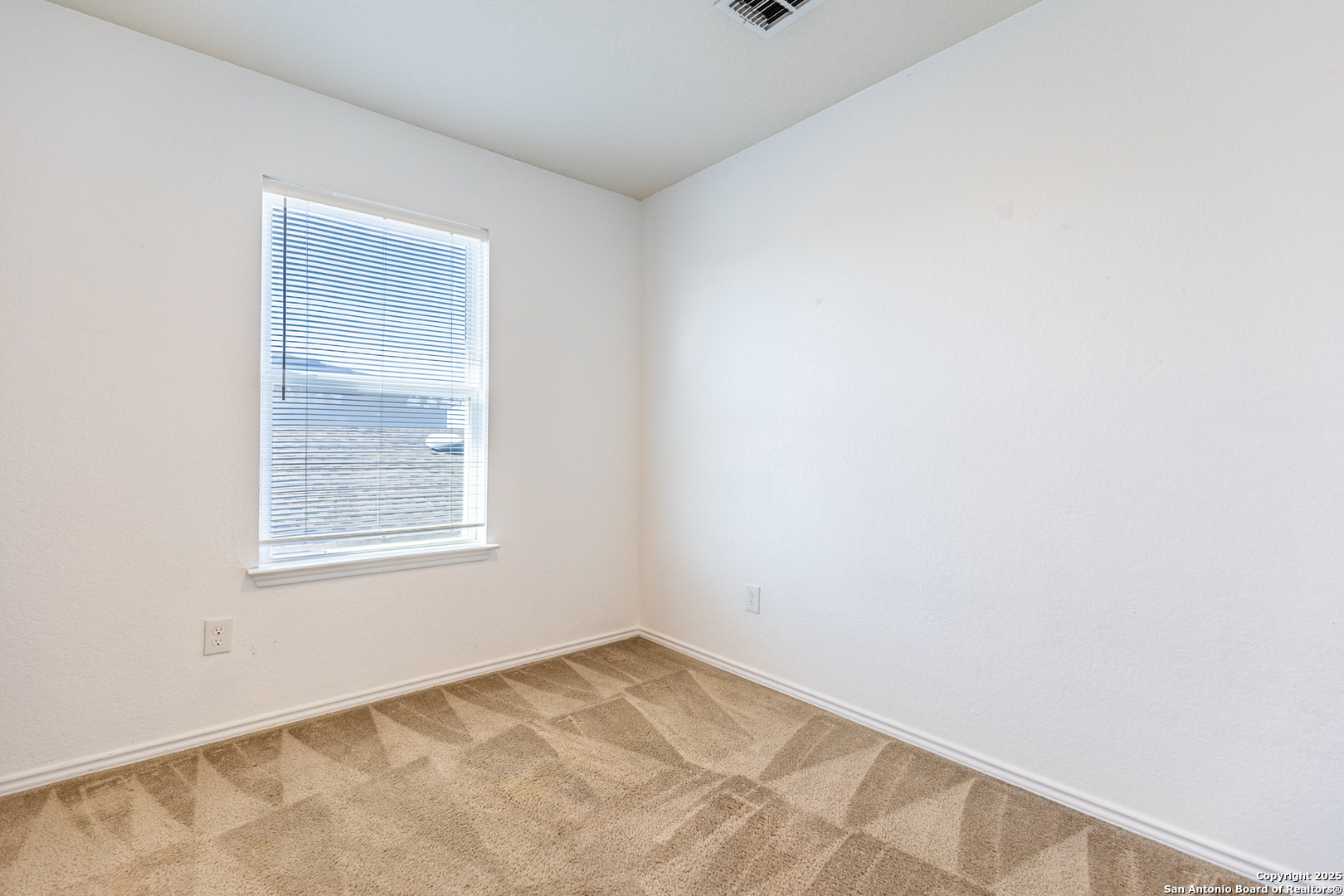 443 Harvest Point Selma, TX 78154 - Photo 22 of 33 an empty room with a window