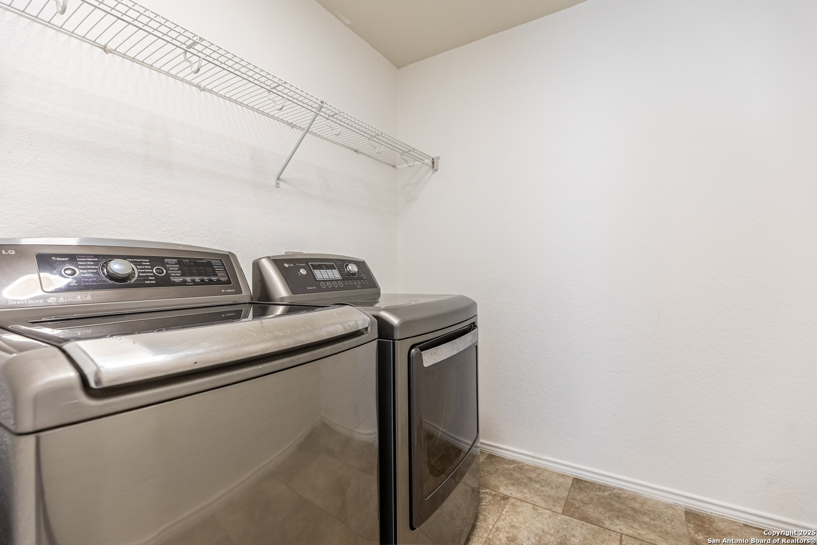 443 Harvest Point Selma, TX 78154 - Photo 27 of 33 a utility room with dryer and washer