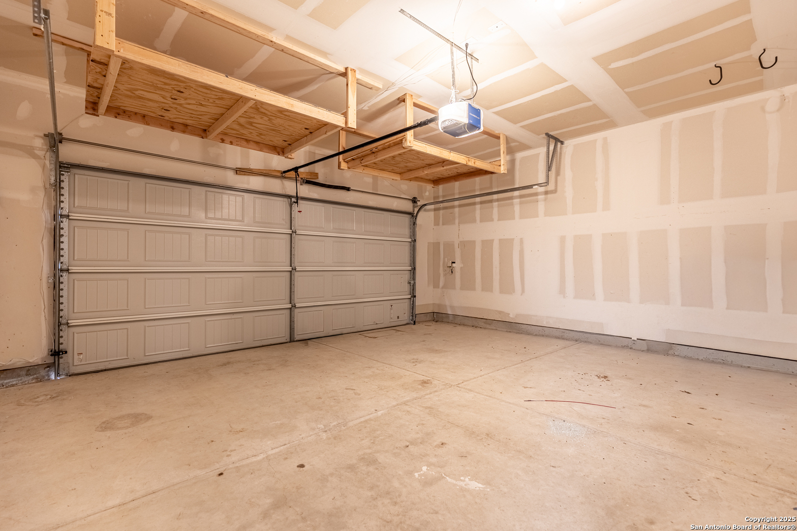 443 Harvest Point Selma, TX 78154 - Photo 28 of 33 a view of a garage with wooden walls