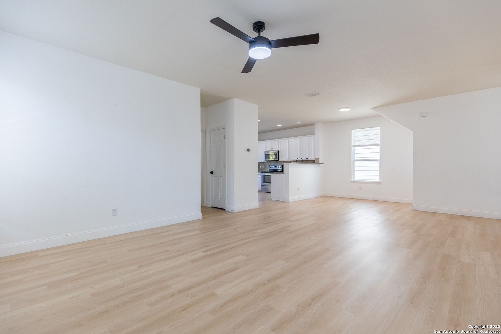 443 Harvest Point Selma, TX 78154 - Photo 6 of 33 a view of empty room with wooden floor and ceiling fan