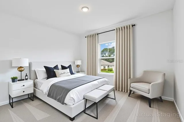 a bedroom with a bed and a couch