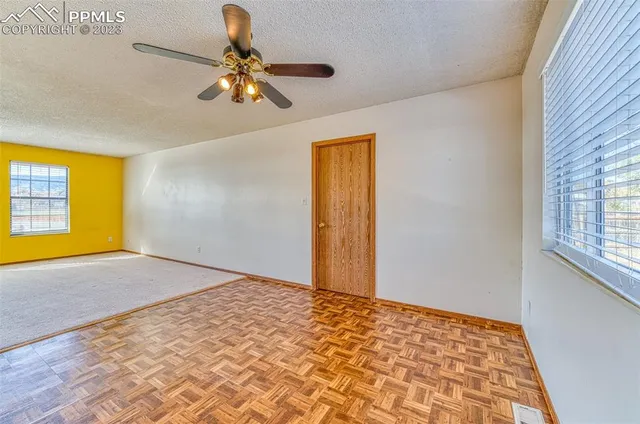 a view of an empty room and window
