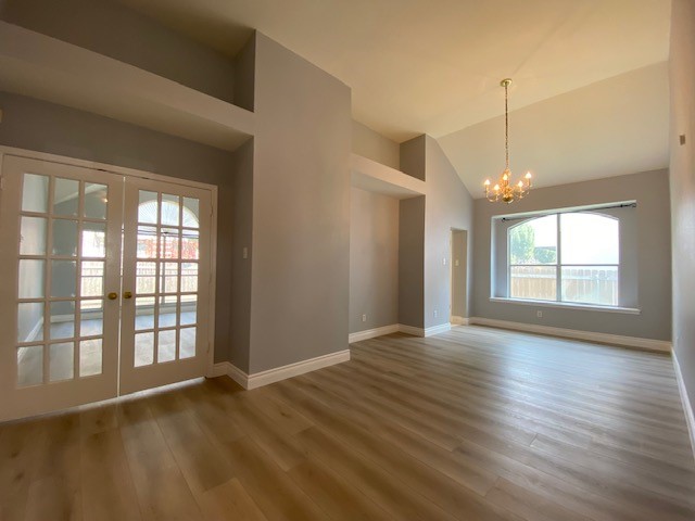 1512 Lorson Loop Round Rock, TX 78665 - Photo 11 of 29 a view of an empty room with wooden floor and a window
