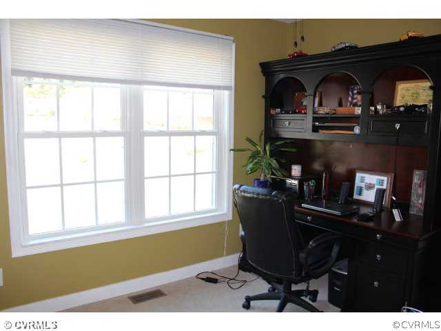 11605 Hillside Road Chester, VA 23831 - Photo 11 of 24 a living room with furniture and a window