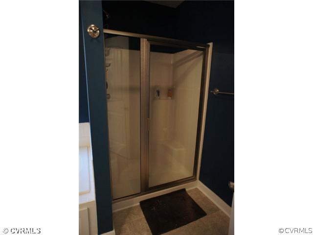 11605 Hillside Road Chester, VA 23831 - Photo 14 of 24 a view of bathroom with a shower and a mirror
