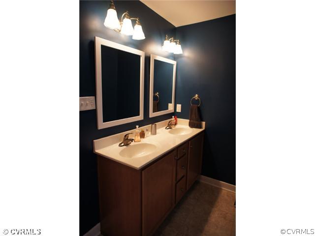 11605 Hillside Road Chester, VA 23831 - Photo 15 of 24 a bathroom with a sink and a mirror