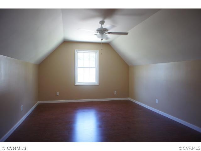 11605 Hillside Road Chester, VA 23831 - Photo 17 of 24 a view of an empty room with window and wooden floor