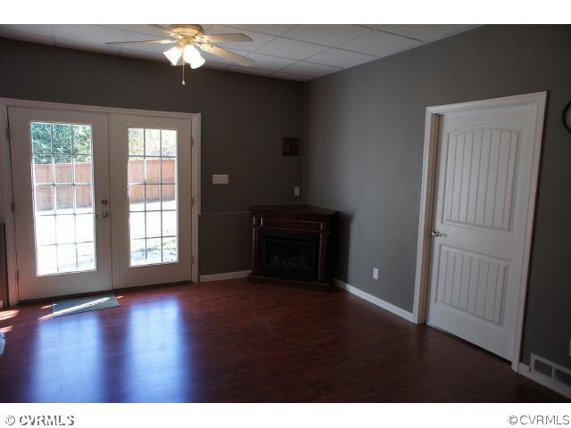 11605 Hillside Road Chester, VA 23831 - Photo 19 of 24 a view of an empty room with wooden floor and a window