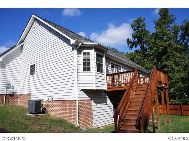 11605 Hillside Road Chester, VA 23831 - Photo 2 of 24 a view of house with backyard and deck