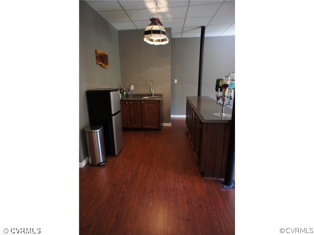 11605 Hillside Road Chester, VA 23831 - Photo 22 of 24 a kitchen with a sink and a refrigerator