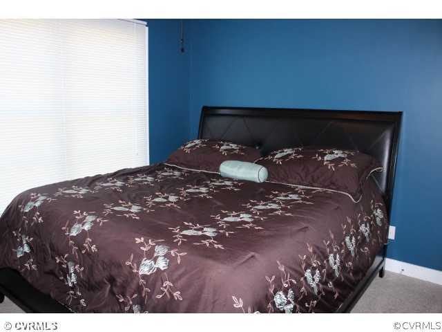 11605 Hillside Road Chester, VA 23831 - Photo 10 of 24 a bedroom with a bed and a night stand