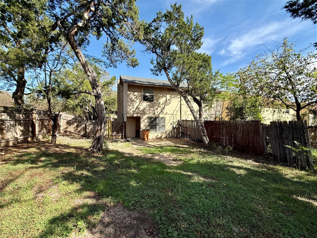 1509 Cinnamon Path, Unit B Austin, TX 78704 - Photo 11 of 19 a view of a backyard with a tree
