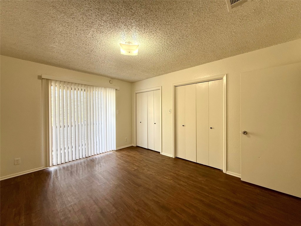 1509 Cinnamon Path, Unit B Austin, TX 78704 - Photo 12 of 19 wooden floor in an empty room with a window