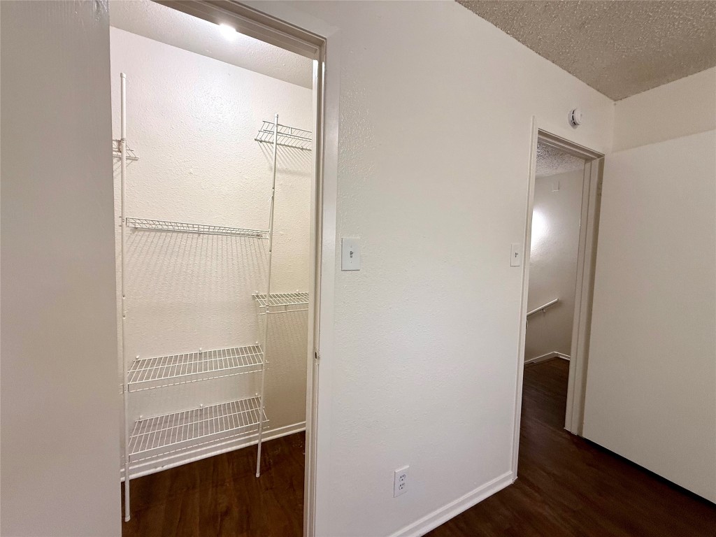 1509 Cinnamon Path, Unit B Austin, TX 78704 - Photo 19 of 19 a view of walk in closet with empty racks