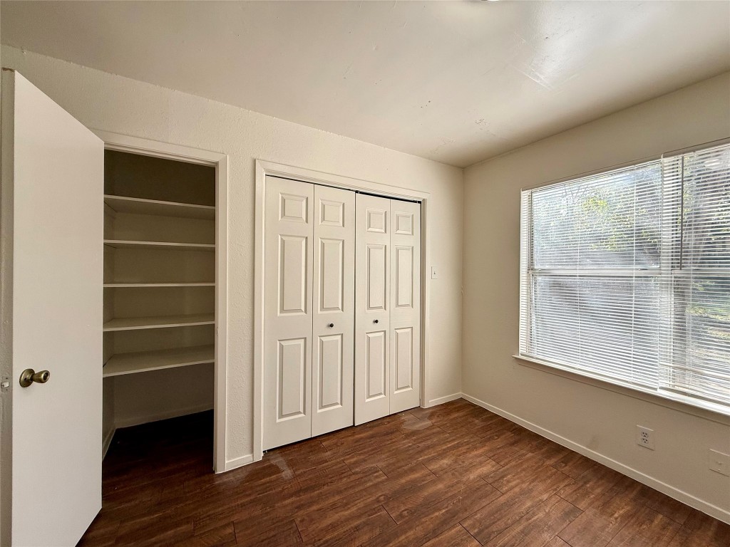 1509 Cinnamon Path, Unit B Austin, TX 78704 - Photo 7 of 19 wooden floor in an empty room with a window