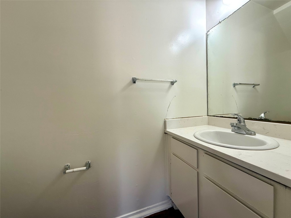 1509 Cinnamon Path, Unit B Austin, TX 78704 - Photo 9 of 19 a bathroom with a sink and mirror
