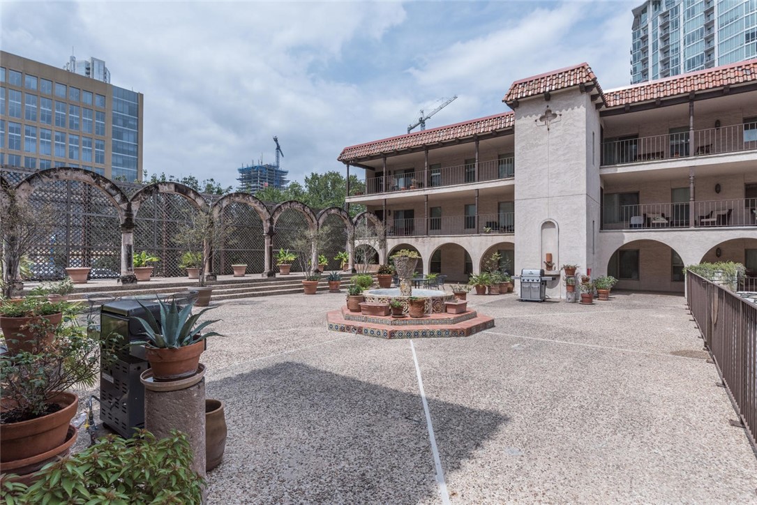 505 West 7th Street, Unit 103 Austin, TX 78701 - Photo 20 of 21 a front view of house with outdoor space patio and outdoor seating