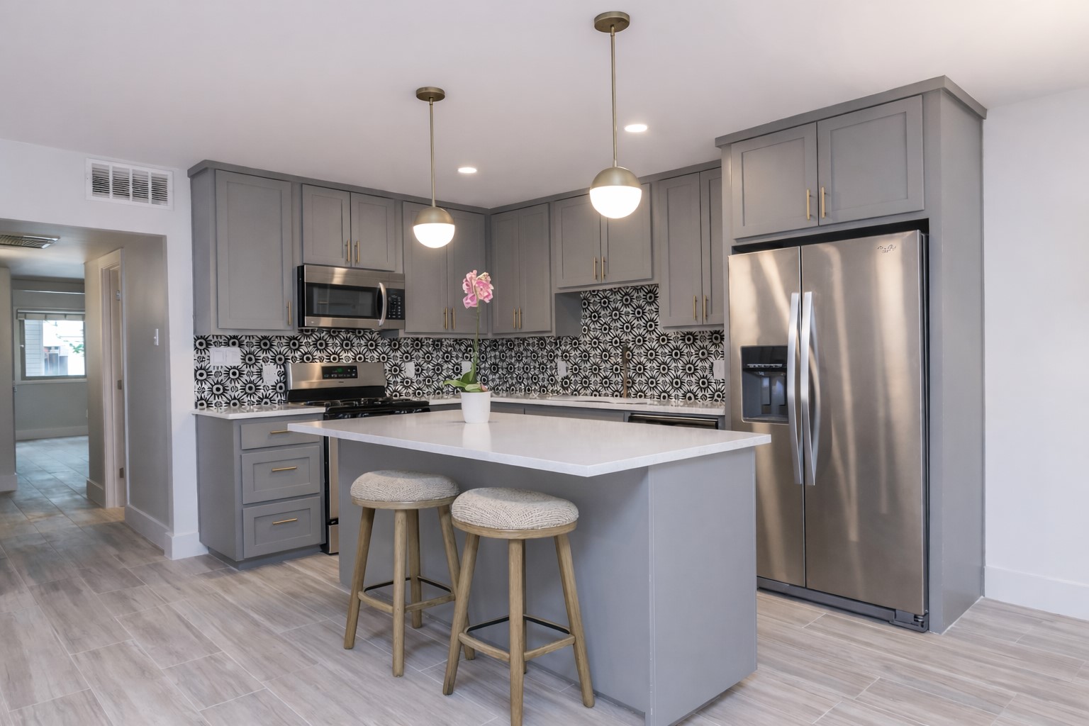 505 West 7th Street, Unit 103 Austin, TX 78701 - Photo 2 of 21 a kitchen with kitchen island a center island a counter space stainless steel appliances and cabinets