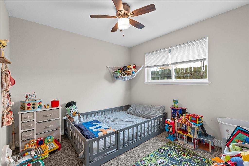 2517 Conrad Street Bossier City, LA 71111 - Photo 29 of 39 a bedroom with furniture and a baby crib