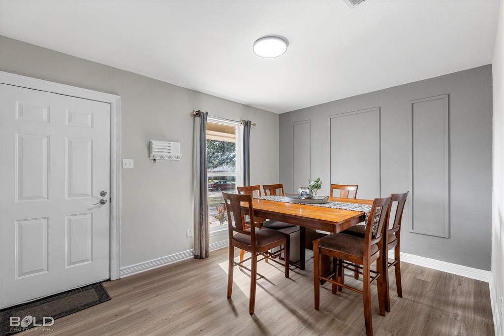 2517 Conrad Street Bossier City, LA 71111 - Photo 10 of 39 a view of a dining room with furniture and wooden floor