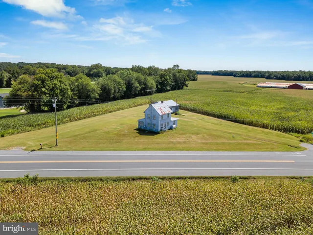 a view of a swimming pool and a yard