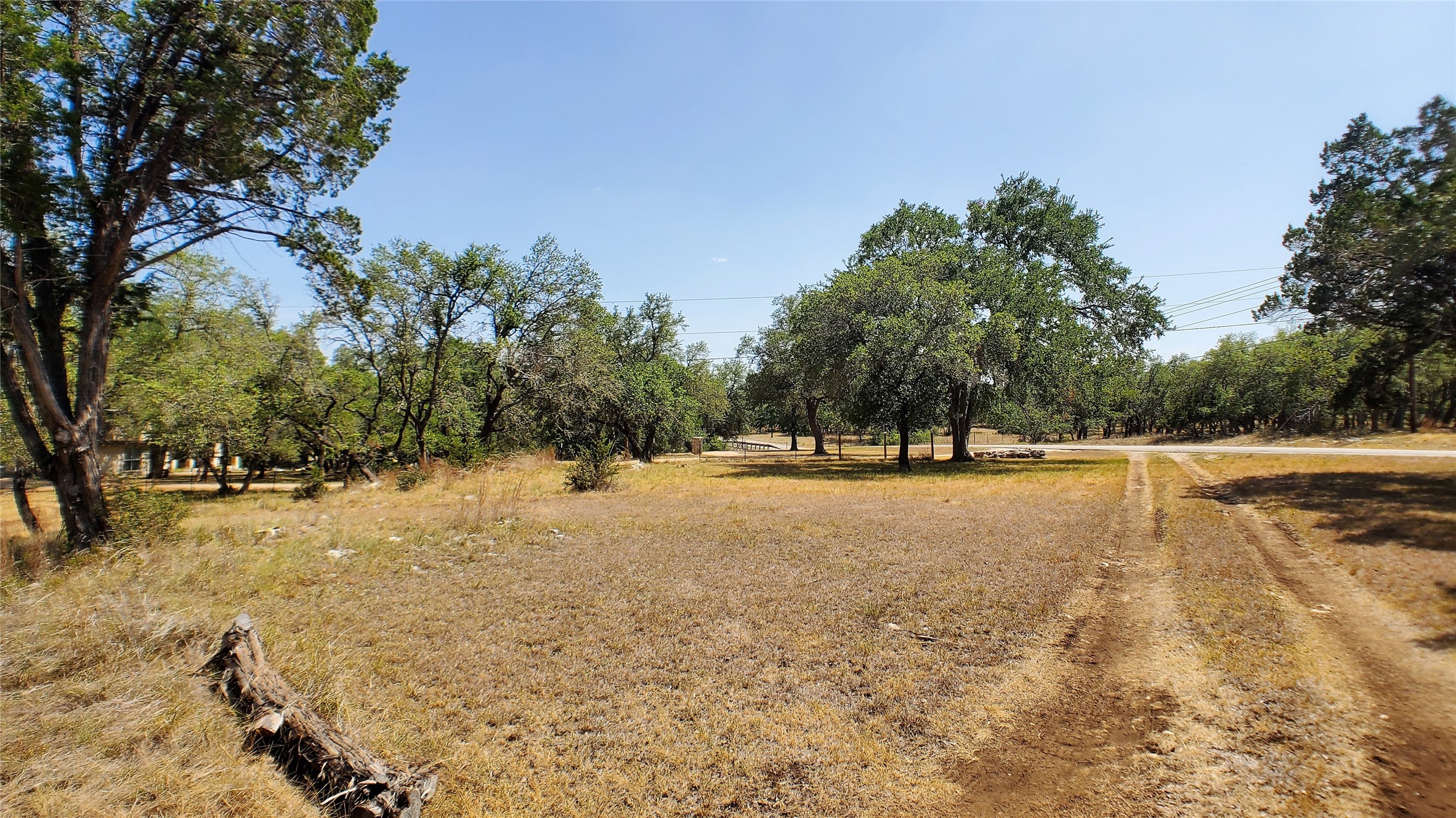 650 Beauchamp Road Dripping Springs, TX 78620 - Photo 6 of 12 a view of a lake with trees